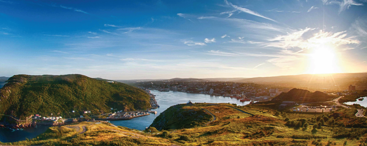 Solar panels in Newfoundland with rugged landscape