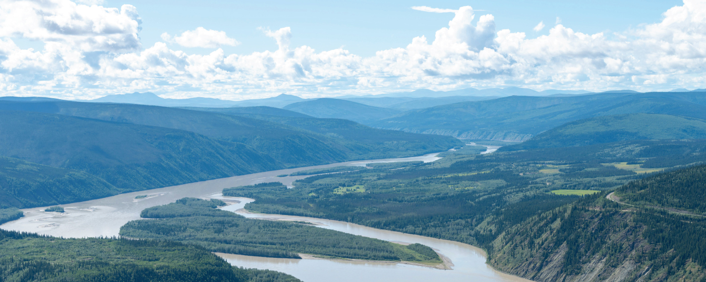Solar panels in Yukon with northern wilderness backdrop